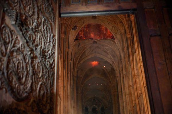 Flames and smoke are seen as the interior continues to burn inside the Notre Dame Cathedral in Paris, France, April 16, 2019.  - Sputnik International