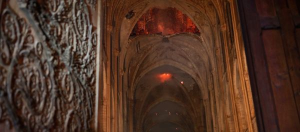 Flames and smoke are seen as the interior continues to burn inside the Notre Dame Cathedral in Paris, France, April 16, 2019. Flames and smoke are seen as the interior continues to burn inside the Notre Dame Cathedral in Paris, France, April 16, 2019. - Sputnik International
