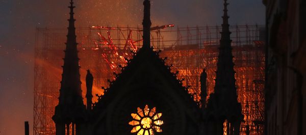 Flames and smoke rise from Notre Dame cathedral as it burns in Paris, Monday, April 15, 2019 Flames and smoke rise from Notre Dame cathedral as it burns in Paris, Monday, April 15, 2019 - Sputnik International