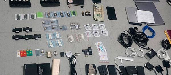 This Friday, April 12, 2019 handout photo provided by the State Attorney General's Office, shows items confiscated from the Ecuadorian residence of Swedish programmer Ola Bini, who was arrested Thursday, April 11, 2019, at the airport in Quito, Ecuador, while preparing to board a flight to Japan. This Friday, April 12, 2019 handout photo provided by the State Attorney General's Office, shows items confiscated from the Ecuadorian residence of Swedish programmer Ola Bini, who was arrested Thursday, April 11, 2019, at the airport in Quito, Ecuador, while preparing to board a flight to Japan. - Sputnik International