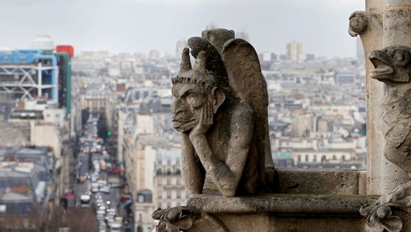 The Stryga, the most famous chimera of Notre Dame Cathedral, overlooks the French capital, in Paris, France, January 14, 2016 The Stryga, the most famous chimera of Notre Dame Cathedral, overlooks the French capital, in Paris, France, January 14, 2016 - Sputnik International