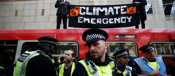 Police is seen as climate change activists demonstrate during the Extinction Rebellion protest, at Canary Wharf DLR station in London, Britain April 17, 2019. Police is seen as climate change activists demonstrate during the Extinction Rebellion protest, at Canary Wharf DLR station in London, Britain April 17, 2019. - Sputnik International