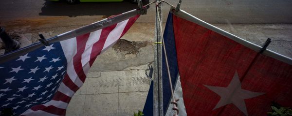 A U.S., and a Cuban national flag, hang from a balcony to mark the restored full diplomatic relations between Cuba and the Unites States, in Old Havana, Monday, July 20, 2015 A U.S., and a Cuban national flag, hang from a balcony to mark the restored full diplomatic relations between Cuba and the Unites States, in Old Havana, Monday, July 20, 2015 - Sputnik International