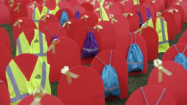 Red mock tombstones designating some of the more than 1,000 people who took their lives by suicide in Washington state in 2017 are displayed on a grassy area near the Legislative Building, Tuesday, March 12, 2019, at the Capitol in Olympia, Wash - Sputnik International