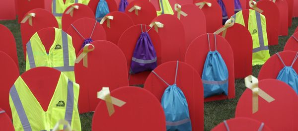 Red mock tombstones designating some of the more than 1,000 people who took their lives by suicide in Washington state in 2017 are displayed on a grassy area near the Legislative Building, Tuesday, March 12, 2019, at the Capitol in Olympia, Wash - Sputnik International