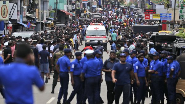 Sri Lankan police officers clear the road as an ambulance drives through carrying injured of Church blasts in Colombo, Sri Lanka, Sunday, April 21, 2019. A Sri Lanka hospital spokesman says several blasts on Easter Sunday have killed dozens of people. Sri Lankan police officers clear the road as an ambulance drives through carrying injured of Church blasts in Colombo, Sri Lanka, Sunday, April 21, 2019. A Sri Lanka hospital spokesman says several blasts on Easter Sunday have killed dozens of people. - Sputnik International