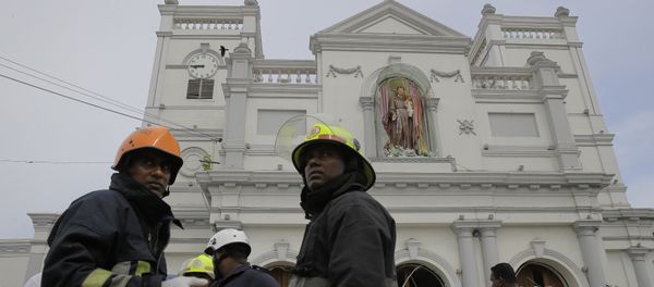 Sri Lankan firefighters stand in the area around St. Anthony's Shrine after a blast in Colombo, Sri Lanka, Sunday, April 21, 2019. Sri Lankan firefighters stand in the area around St. Anthony's Shrine after a blast in Colombo, Sri Lanka, Sunday, April 21, 2019. - Sputnik International