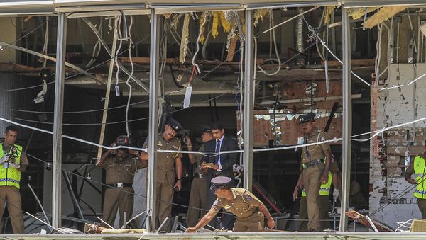 A Sri Lankan Police officer inspects a blast spot at the Shangri-la hotel in Colombo, Sri Lanka, Sunday, April 21, 2019. A Sri Lankan Police officer inspects a blast spot at the Shangri-la hotel in Colombo, Sri Lanka, Sunday, April 21, 2019. - Sputnik International