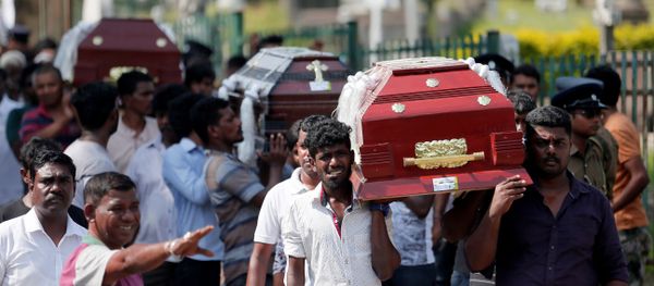 Coffins of victims are carried during a mass for victims, two days after a string of suicide bomb attacks on churches and luxury hotels across the island on Easter Sunday, in Colombo, Sri Lanka April 23, 2019. Coffins of victims are carried during a mass for victims, two days after a string of suicide bomb attacks on churches and luxury hotels across the island on Easter Sunday, in Colombo, Sri Lanka April 23, 2019. - Sputnik International