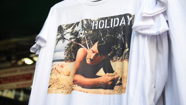 This photo taken on February 27, 2019, shows a t-shirt with a picture depicting a nude Adolf Hitler on a beach for sale at a street market for tourists in Bangkok - Sputnik International