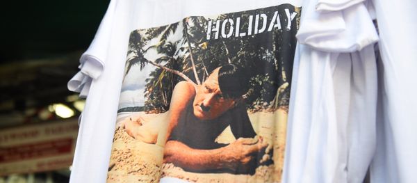 This photo taken on February 27, 2019, shows a t-shirt with a picture depicting a nude Adolf Hitler on a beach for sale at a street market for tourists in Bangkok This photo taken on February 27, 2019, shows a t-shirt with a picture depicting a nude Adolf Hitler on a beach for sale at a street market for tourists in Bangkok - Sputnik International