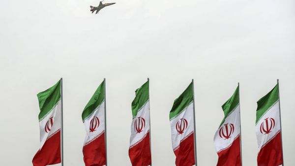 In this photo released by the official website of the office of the Iranian Presidency, a fighter jet flies over Iranian flags during the army parade commemorating National Army Day in front of the shrine of the late revolutionary founder Ayatollah Khomeini, just outside Tehran, Iran, Thursday, April 18, 2019 - Sputnik International