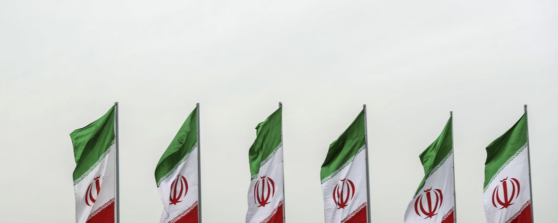 In this photo released by the official website of the office of the Iranian Presidency, a fighter jet flies over Iranian flags during the army parade commemorating National Army Day in front of the shrine of the late revolutionary founder Ayatollah Khomeini, just outside Tehran, Iran, Thursday, April 18, 2019 In this photo released by the official website of the office of the Iranian Presidency, a fighter jet flies over Iranian flags during the army parade commemorating National Army Day in front of the shrine of the late revolutionary founder Ayatollah Khomeini, just outside Tehran, Iran, Thursday, April 18, 2019 - Sputnik International, 1920, 10.05.2021
