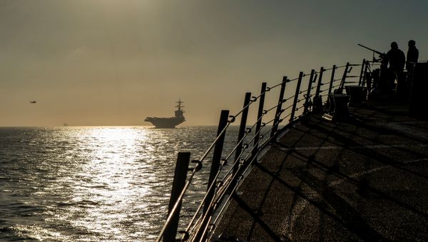 Sailors stand watch on the brow of the Arleigh Burke-class guided-missile destroyer USS Bainbridge while the ship follows the Nimitz-class aircraft carrier USS Abraham Lincoln into the Strait of Gibraltar in the Atlantic Ocean, April 13, 2019. Picture taken on April 13, 2019 Sailors stand watch on the brow of the Arleigh Burke-class guided-missile destroyer USS Bainbridge while the ship follows the Nimitz-class aircraft carrier USS Abraham Lincoln into the Strait of Gibraltar in the Atlantic Ocean, April 13, 2019. Picture taken on April 13, 2019 - Sputnik International