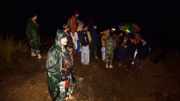 Pakistani soldiers and media personnel gather at the site where the Indian Air Force (IAF) strike launched on a Jaish-e-Mohammad (JeM) camp at Balakot on February 26, 2019. India said on February 26, 2019, it had launched air strikes against militant camps in Pakistan’s territory, triggering international concern over a dangerous escalation between the nuclear-armed rivals - Sputnik International