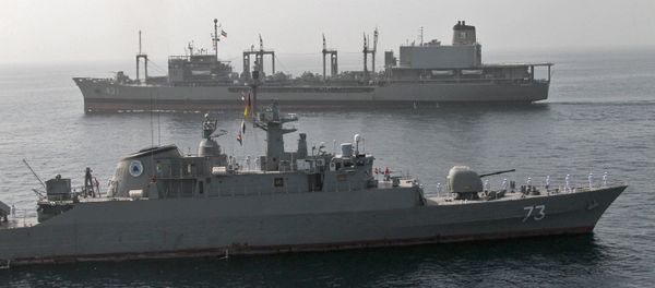 A handout photo made available by the Iranian Navy office on February 23, 2019, shows an Iranian Navy battleship sailing during a military drill in the Gulf of Oman, on February 22 - Sputnik International