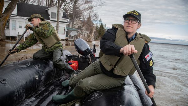 Royal Canadian Navy and Royal Canadian Engineers personnel patrol an area of flooding to look for those in need of help or evacuation in Maskinonge, south of Trois-Rivieres, Quebec, Canada. File photo - Sputnik International