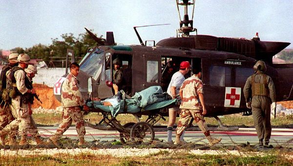 US helicopter pilot Michael Durant is carried on a stretcher to the helicopter from the 46th Combat Support hospital. - Sputnik International