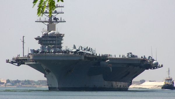 A picture taken on June 13, 2013 shows the American Nimitz-class aircraft carrier USS Dwight D. Eisenhower crossing the Suez canal off the coast of Ismailia port city, east of Cairo - Sputnik International