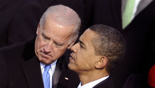 US President Barack Obama (R) and Vice President Joe Biden speak during Obama's inauguration as the 44th US president at the Capitol in Washington, DC - Sputnik International