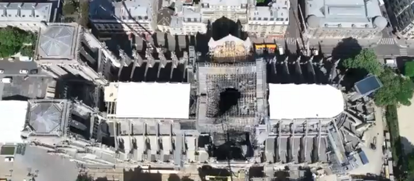 A drone video by Paris Prefecture de Police shows Notre Dame cathedral's roof secured following a massive fire two weeks prior - Sputnik International