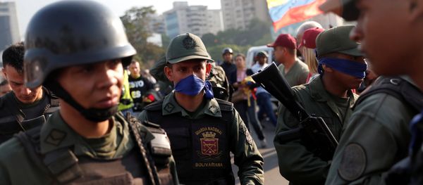 Military members stand near the Generalisimo Francisco de Miranda Airbase La Carlota, in Caracas, Venezuela April 30, 2019 - Sputnik International