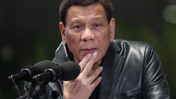 This handout photo taken on June 2, 2018, shows Philippine President Rodrigo Duterte gesturing as he gives his departure speech at the Manila International airport This handout photo taken on June 2, 2018, shows Philippine President Rodrigo Duterte gesturing as he gives his departure speech at the Manila International airport - Sputnik International
