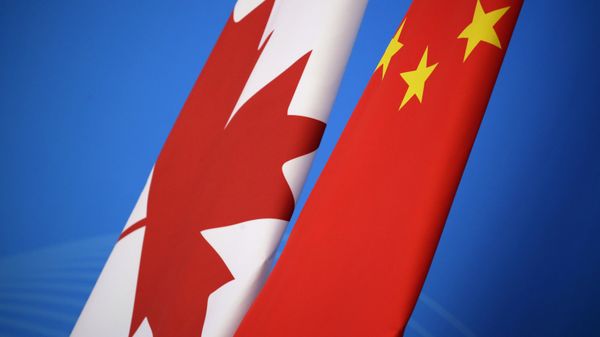 Flags of Canada and China are placed for the first China-Canada economic and financial strategy dialogue in Beijing, China, Monday, Nov. 12, 2018. Flags of Canada and China are placed for the first China-Canada economic and financial strategy dialogue in Beijing, China, Monday, Nov. 12, 2018. - Sputnik International