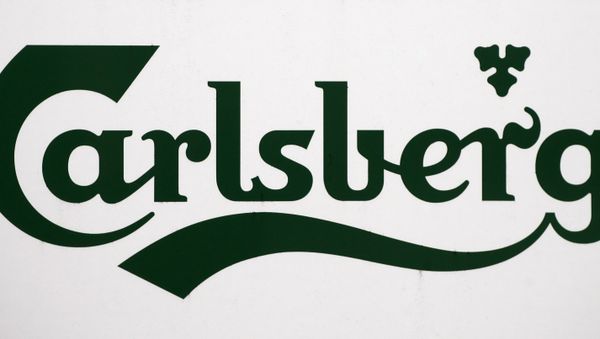 A Carlsberg logo is pictured on a signboard at the brewery in Leeds in west Yorkshire in northeast England, on November 5, 2008 - Sputnik International