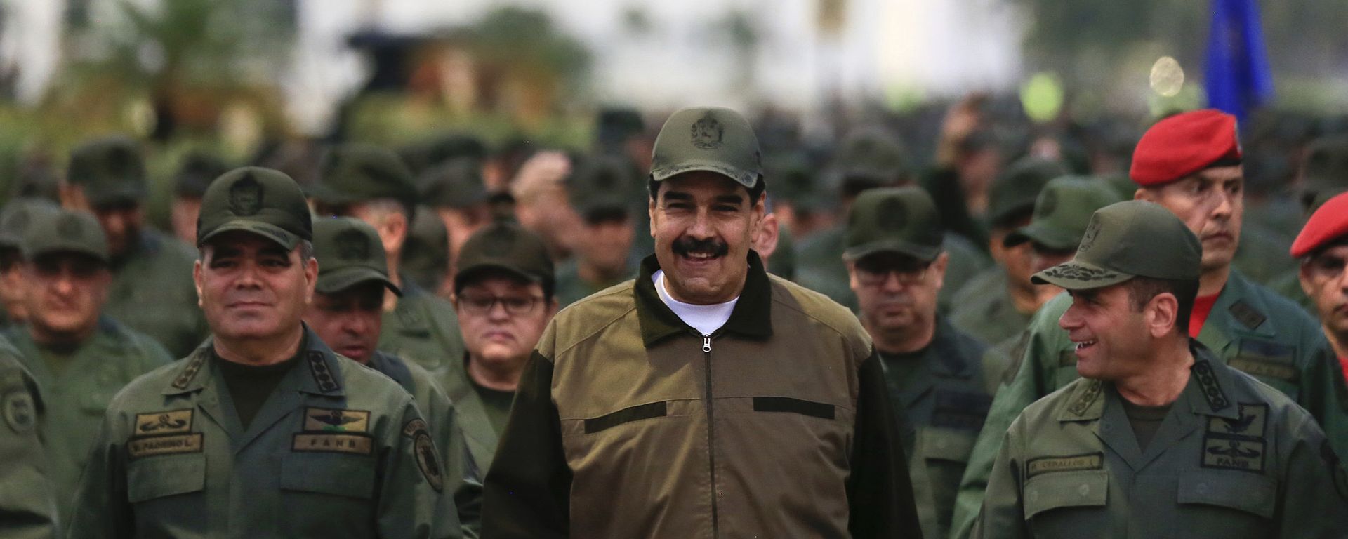 In this handout photo released by Miraflores Press Office, Venezuela's President Nicolas Maduro, center, accompanied by Defense Minister Gen. Vladimir Padrino Lopez, left, and the Strategies Operations Commander, Adm. Remigio Ceballos, arrive for a meeting with the troops at Fort Tiuna in Caracas, Venezuela, Thursday, May 2, 2019 In this handout photo released by Miraflores Press Office, Venezuela's President Nicolas Maduro, center, accompanied by Defense Minister Gen. Vladimir Padrino Lopez, left, and the Strategies Operations Commander, Adm. Remigio Ceballos, arrive for a meeting with the troops at Fort Tiuna in Caracas, Venezuela, Thursday, May 2, 2019 - Sputnik International, 1920, 16.08.2023