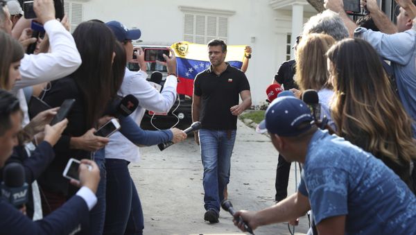 Venezuelan opposition leader Leopoldo Lopez walks to gate of the Spanish ambassador's residence in Caracas to speak with the press, in Venezuela, Thursday, May 2, 2019 - Sputnik International