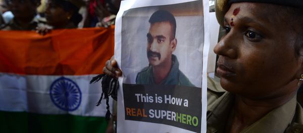 Indian security forces pose with the national flag and pictures of Indian Air Force pilot Abhinandan Varthaman during an event to pray for his return, at Kalikambal temple in Chennai on March 1, 2019. Indian security forces pose with the national flag and pictures of Indian Air Force pilot Abhinandan Varthaman during an event to pray for his return, at Kalikambal temple in Chennai on March 1, 2019. - Sputnik International