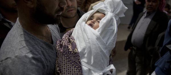 A relative of a Palestinian, 14-month-old, Seba Abu Arar, carry her body out of the Shifa hospital morgue before her funeral in Gaza City, Sunday, May. 5, 2019. Gaza's Health Ministry said the Palestinian infant was killed when Israeli aircraft hit near her house A relative of a Palestinian, 14-month-old, Seba Abu Arar, carry her body out of the Shifa hospital morgue before her funeral in Gaza City, Sunday, May. 5, 2019. Gaza's Health Ministry said the Palestinian infant was killed when Israeli aircraft hit near her house - Sputnik International