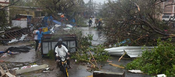 People move through debris on a road after Cyclone Fani hit Puri, in the eastern state of Odisha, India, May 3, 2019 People move through debris on a road after Cyclone Fani hit Puri, in the eastern state of Odisha, India, May 3, 2019 - Sputnik International