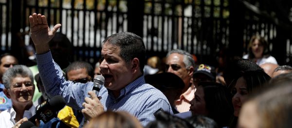 Luis Florido, lawmaker of the Venezuelan coalition of opposition parties (MUD), speaks during a gathering with opposition supporters in Caracas, Venezuela March 17, 2018. REUTERS/Marco Bello/File Photo - Sputnik International
