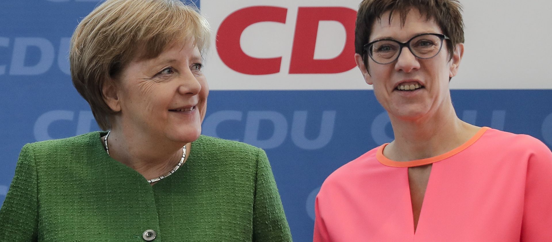 German Chancellor Angela Merkel, left, and the governor of German Saarland state and designated Christian Democratic Union party General Secretary, Annegret Kramp-Karrenbauer, right, attend a party leaders' meeting in Berlin, Germany. 19 February, 2018 German Chancellor Angela Merkel, left, and the governor of German Saarland state and designated Christian Democratic Union party General Secretary, Annegret Kramp-Karrenbauer, right, attend a party leaders' meeting in Berlin, Germany. 19 February, 2018 - Sputnik International, 1920, 29.08.2019