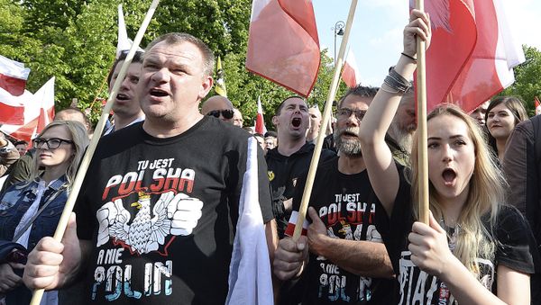 Thousands of Polish nationalists march to the U.S. Embassy, in Warsaw, Poland, Saturday, May 11, 2019. Thousands of Polish nationalists have marched to the U.S. Embassy in Warsaw, protesting that the U.S. is putting pressure on Poland to compensate Jews whose families lost property during the Holocaust. The protesters included far-right groups and their supporters. They said the United States has no right to interfere in Polish affairs and that the U.S. government is putting Jewish interests over the interests of Poland. The T-shirts read in Polish This is Poland not Polin - Sputnik International
