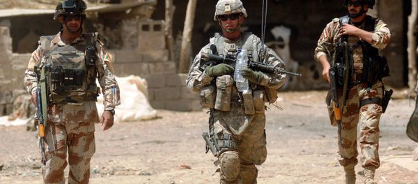 U.S. Army Capt. Eric Morton, center, commander of the 101st Airborne Division's Company B, 1st Battalion, 35th Armor Regiment, walks with Iraqi Maj. Ahmed Hassan and Iraqi 1st Lt. Yasev Mutasam through Shakriyah, Iraq, area during Operation New Town, June 10, 2008 U.S. Army Capt. Eric Morton, center, commander of the 101st Airborne Division's Company B, 1st Battalion, 35th Armor Regiment, walks with Iraqi Maj. Ahmed Hassan and Iraqi 1st Lt. Yasev Mutasam through Shakriyah, Iraq, area during Operation New Town, June 10, 2008 - Sputnik International