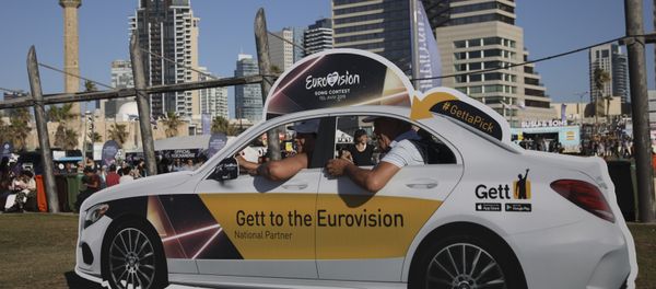 People pose in a cutout taxi cab ahead of the 2019 Eurovision Song Contest in Tel Aviv, Israel, Monday, May 13, 2019 People pose in a cutout taxi cab ahead of the 2019 Eurovision Song Contest in Tel Aviv, Israel, Monday, May 13, 2019 - Sputnik International