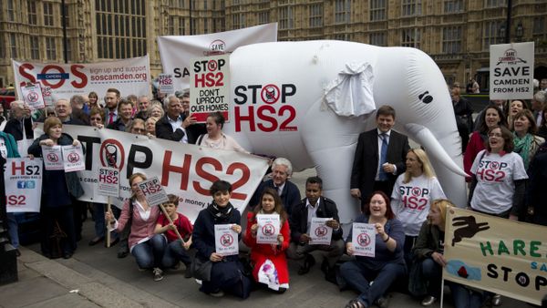 Demonstrators against HS2 pose outside the UK Parliament in 2014 with a giant white elephant Demonstrators against HS2 pose outside the UK Parliament in 2014 with a giant white elephant - Sputnik International
