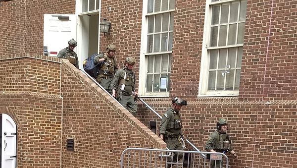 Police are seen walking out of a door at the Venezuelan embassy in Washington D.C., U.S. May 16, 2019 in this picture obtained from social media Police are seen walking out of a door at the Venezuelan embassy in Washington D.C., U.S. May 16, 2019 in this picture obtained from social media - Sputnik International