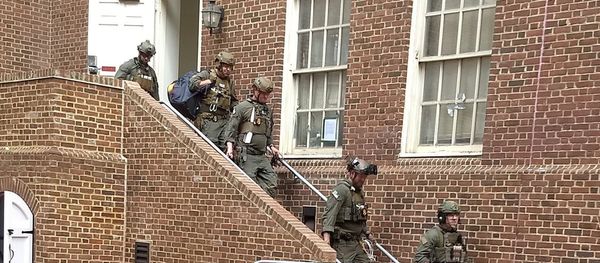 Police are seen walking out of a door at the Venezuelan embassy in Washington D.C., U.S. May 16, 2019 in this picture obtained from social media Police are seen walking out of a door at the Venezuelan embassy in Washington D.C., U.S. May 16, 2019 in this picture obtained from social media - Sputnik International