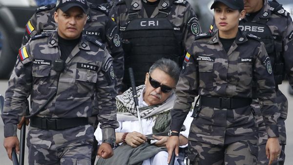 Prison guards escort former rebel leader Seuxis Hernandez outside La Picota jail in Bogota, Colombia, Friday, May 17, 2019 - Sputnik International