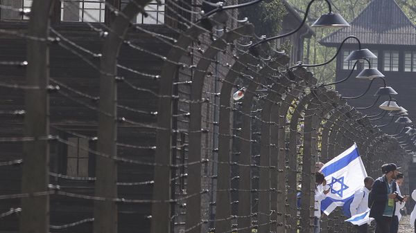 People take part in a Holocaust remembrance walk in the former Nazi German Second World War death camp of Auschwitz shortly before the start of the annual March of the Living when Jewish youths from all over the world walk from Auschwitz to Birkenau in memory of the six million Holocaust victims, in Oswiecim, Poland, Thursday, 2 May 2019. - Sputnik International