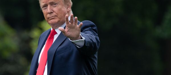 (FILES) In this file photo taken on May 8, 2019, US President Donald Trump waves as he walks to Marine One prior to departing from the South Lawn of the White House in Washington, DC, May 8, 2019 - Sputnik International