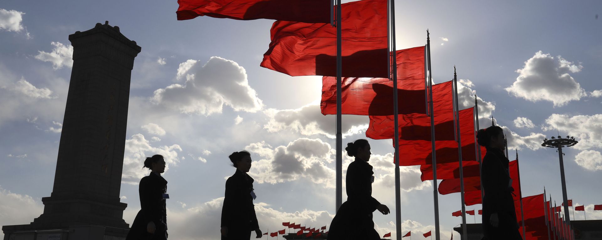 Bus ushers walk past red flags on Tiananmen Square during a plenary session of the Chinese People's Political Consultative Conference (CPPCC) at the Great Hall of the People in Beijing Monday, March 11, 2019 Bus ushers walk past red flags on Tiananmen Square during a plenary session of the Chinese People's Political Consultative Conference (CPPCC) at the Great Hall of the People in Beijing Monday, March 11, 2019 - Sputnik International, 1920, 04.03.2021