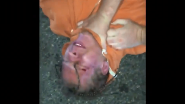 Teenager Cyprian Luke is seen in cellphone footage being pinned to the ground by three officers with New Jersey's Dover Police Department and later punched several times in the face by an officer during the arrest. Teenager Cyprian Luke is seen in cellphone footage being pinned to the ground by three officers with New Jersey's Dover Police Department and later punched several times in the face by an officer during the arrest. - Sputnik International