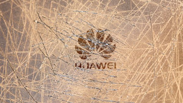 A scratched surface Huawei logo is seen on a smarthphone in this illustration picture taken May 20, 2019 A scratched surface Huawei logo is seen on a smarthphone in this illustration picture taken May 20, 2019 - Sputnik International