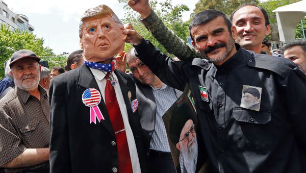 Iranian demonstrators carry a portrait of Iran's Supreme Leader Ayatollah Ali Khamenei and an effigy of US President Donald Trump during a rally in the capital Tehran, on May 10 2019 Iranian demonstrators carry a portrait of Iran's Supreme Leader Ayatollah Ali Khamenei and an effigy of US President Donald Trump during a rally in the capital Tehran, on May 10 2019 - Sputnik International