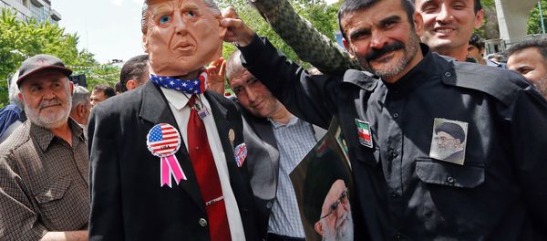 Iranian demonstrators carry a portrait of Iran's Supreme Leader Ayatollah Ali Khamenei and an effigy of US President Donald Trump during a rally in the capital Tehran, on May 10 2019 Iranian demonstrators carry a portrait of Iran's Supreme Leader Ayatollah Ali Khamenei and an effigy of US President Donald Trump during a rally in the capital Tehran, on May 10 2019 - Sputnik International